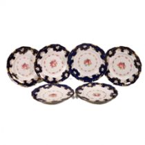 A set of six Royal Crown Derby plates with floral decoration to the centre and blue/gilt pattern ...