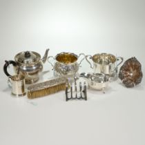 A late Victorian silver sugar bowl by Messrs Barnard; a silver tea pot; a silver two handled bowl...