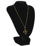 An Edwardian garnet topped doublet and simulated pearl set pendant, tagged ‘9ct’, on a chain, 3.5...