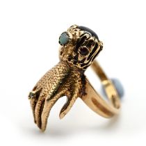 A 9 carat gold hand ring, set with various gems, finger size N, 4.4 grams gross.