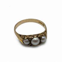 A 9 carat gold three stone cultured pearl dress ring, with rose cut diamonds between, finger size...