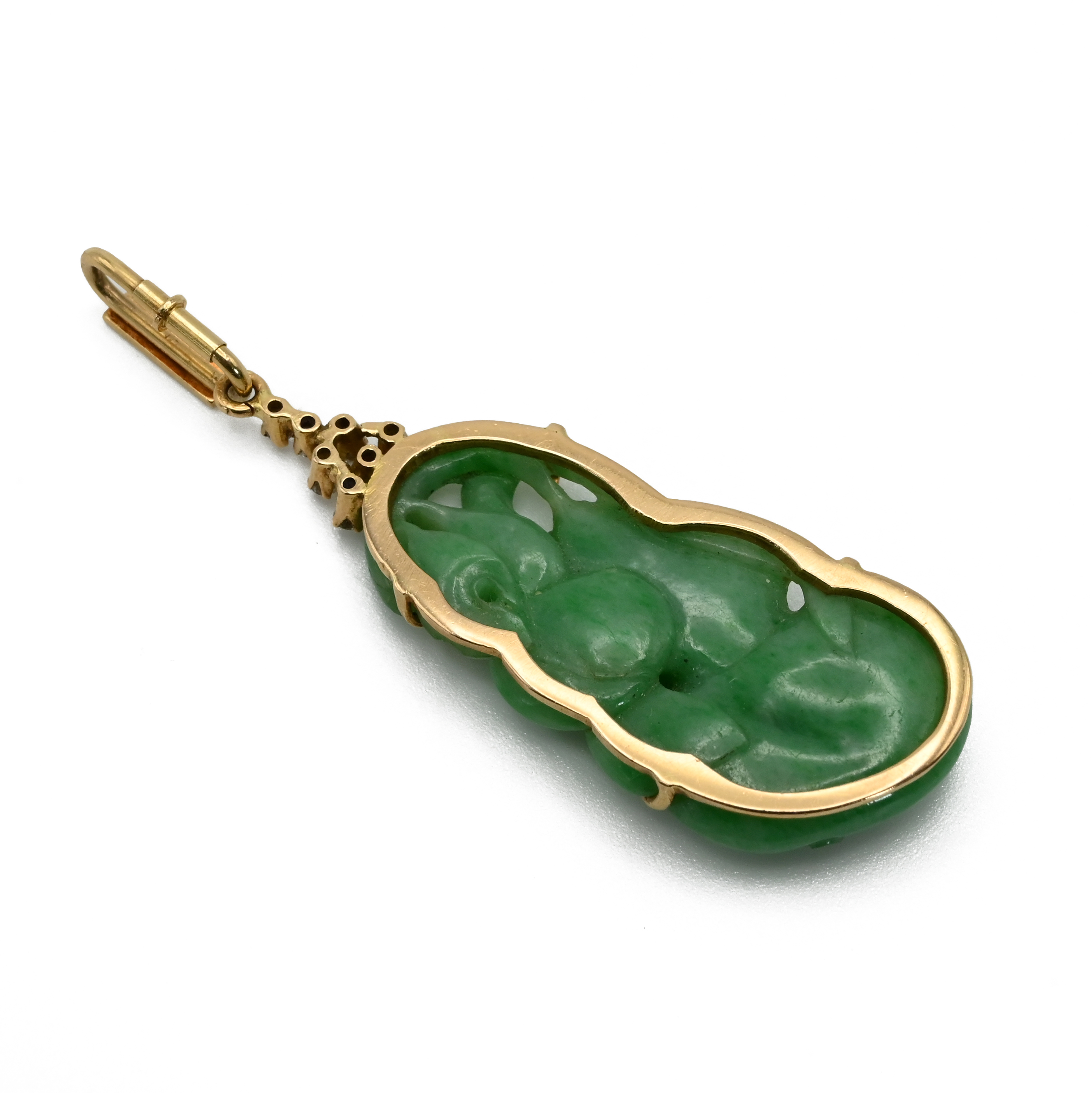 A jade and diamond pendant, the jade carved as a bird and fruit with seven brilliant cuts above,
... - Image 2 of 3