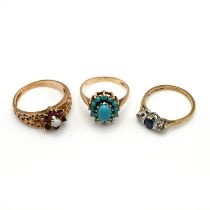 A 9 carat gold three stone sapphire and diamond ring; with a 9 carat gold turquoise cluster ring;...