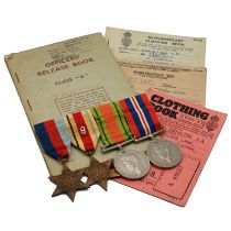 A WWII Medal group comprising: a 1939-45 Star; Africa Star (with 8th Army insignia sewn on); Defe...