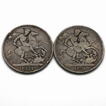 A pair of King George IV silver five shillings crown coins, both dated 1821 and minted in sterlin...