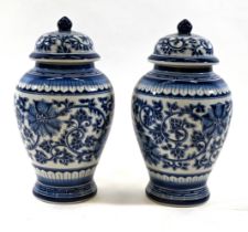A pair of large baluster Blue and White Temple jars with lids. Flower and vine decoration. Dimens...