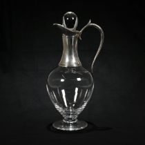 A silver mounted glass claret jug, maker ‘JA?”, London 2000, with stopper, 31 cm high.