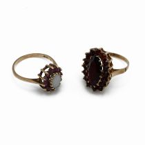 A 9 carat gold garnet cluster ring; with a 9 carat gold opal and garnet cluster ring; 5.7 grams g...