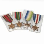 A group of four World War Two star medals to include: The Atlantic Star, The Pacific Star, The Bu...