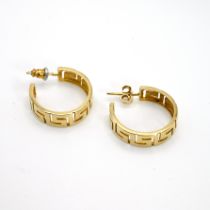 A pair of hoop earrings, pierced with a Greek Key pattern, stamped ‘585’, 5.5 grams gross.