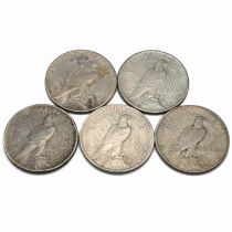 A group of six United States 'Peace' dollars (which coins were minted between 1921 and 1935 and a...