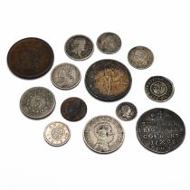 An assortment of GB and world coinage to include: US 1843 Cent and 1877 Dime and 1867 Nickel; Geo...