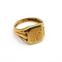 An inscribed signet ring, stamped ‘750’, 2.8 grams gross.