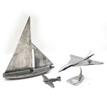 Three (3) sculptures- A contemporary metal sailing boat marked 'Nauticalia, London' to the unders...