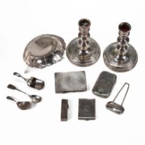 A collection of various silver items to include; A small strawberry dish; two silver cigarette ca...