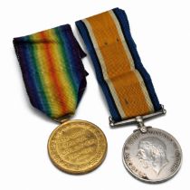 A Pair of World War One medals to include the silver war medal and the victory medal issued to G....