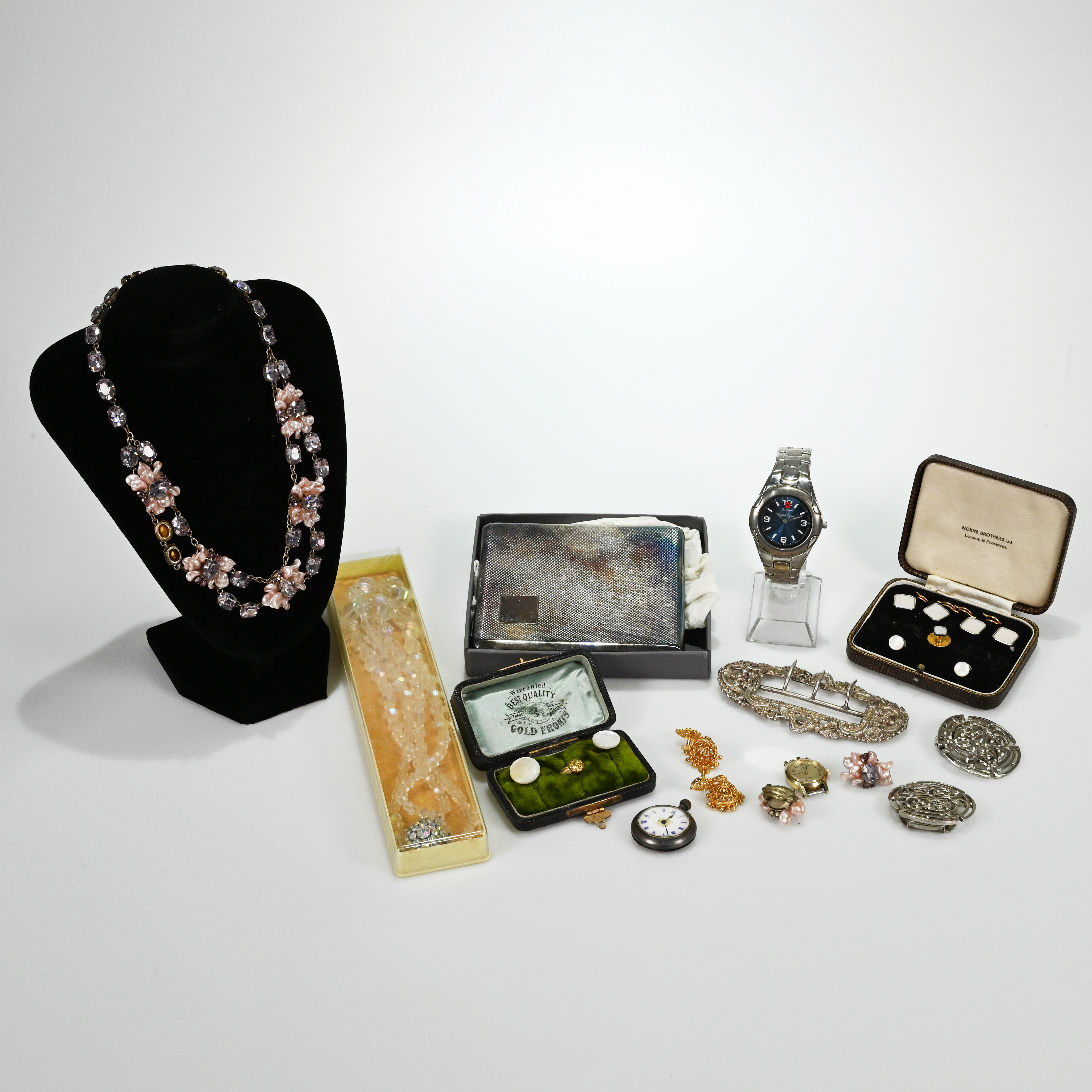 A collection of costume jewellery to include a Victorian silver buckle, two boxed sets of studs a...