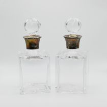 A pair of glass and silver mounted scent bottles, A E Jones, Birmingham 1994, with stoppers, 15cm...