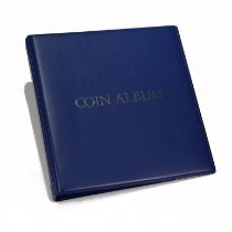 A blue coin collector's album, interior having three pages of GB and World coins, silver and bron...