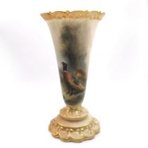 A Royal Worcester blush ivory trumpet vase hand painted with pheasants in a landscape by James St...