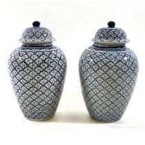A pair of large baluster form Blue and White Temple jars with lids. pineapple tiled decoration. D...