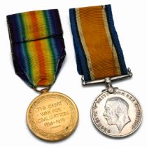 A pair of World War One medals to include the silver War Medal and the Victory Medal issued to 11...