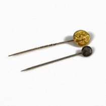 A Persian style gold Daric coin, later mounted on a stick pin, along with one another silver coin...