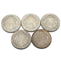 A group of five sterling silver half crown coins issued during the first world war under the reig...