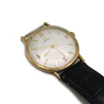 Omega, a gentleman’s 9 carat gold mechanical wrist watch, the signed white dial with gilt Arabic ...