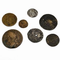 An assortment of early coinage to include: 1689 James II 'Gun Money' half crown coin; Queen Eliza...