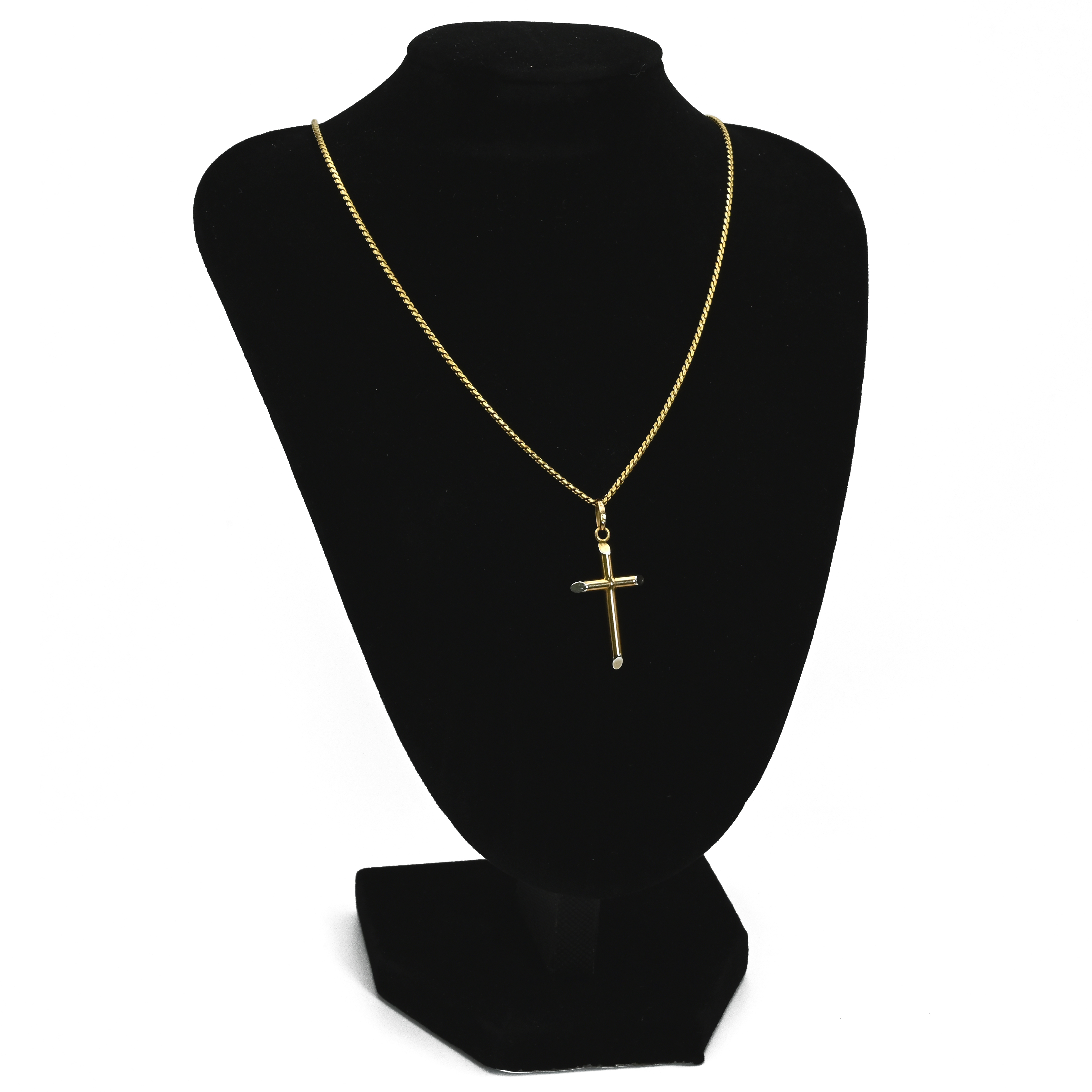 A cross pendant on a chain, both stamped ’750’, 8.4 grams gross.