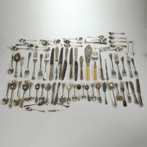 A collection of silver flatware, various makers and dates, including a bottom marked shell bowl s...