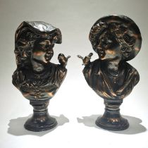 In the manner of August Moreau - a pair of bronzed hollow cast metal busts - a boy and girl each ...