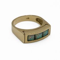 A three stone synthetic opal dress ring, stamped ‘585’, finger size O 1/2, 5.9 grams gross.