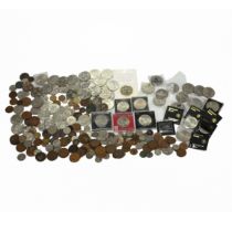 A collection of GB and world coinage to include 1953 Rhodesia crown, USA currency, 18th century t...