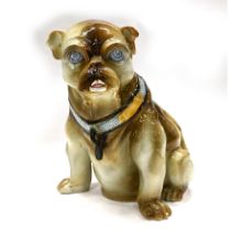 A majolica stick or umbrella stand in the form of a seated pug, made by the Belgian pottery Mouzi...