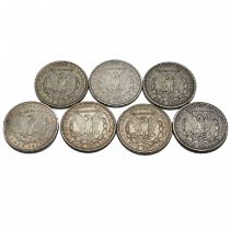 A group of six United States silver 'Morgan' dollars. (Morgan Dollars were issued between 1878 an...