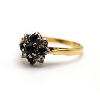 An 18 carat gold sapphire and diamond dress ring, finger size M 1/2, 3 grams gross.