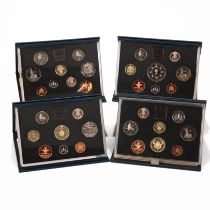 Four Royal Mint Cased Proof Coin Sets to Include: the 1986 Proof Set with Commonwealth Games £2, ...