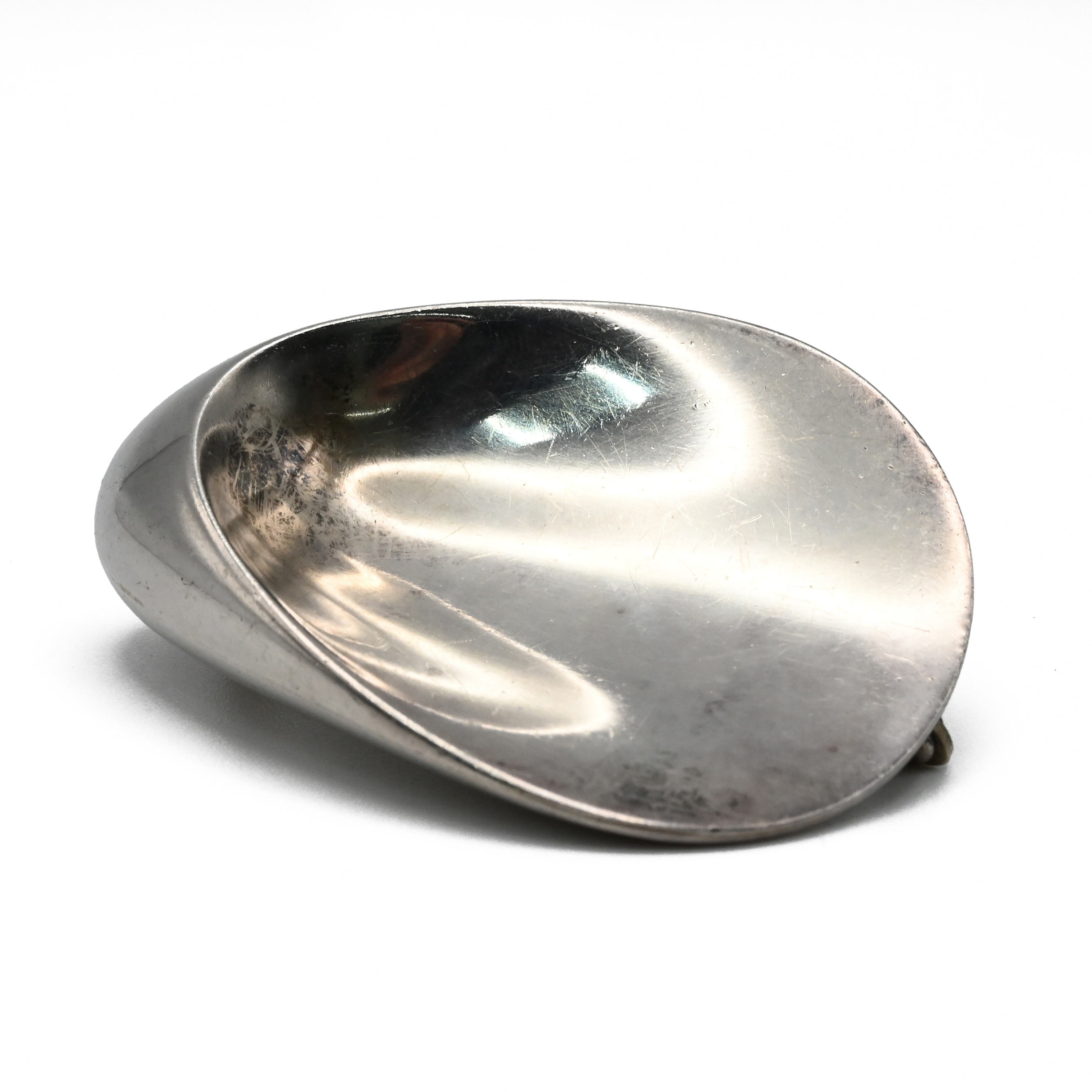 Nanna Ditzel for Georg Jensen, a silver oyster brooch, No. 328, with 1968 London import marks and...