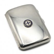 A silver cigar case, Fenton Russell & Co, Chester 1915, applied with an enamelled insignia for th...