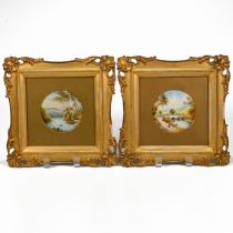 A pair of 19th Century circular ceramic plaques (8.7cm diameter) each painted with landscape scen...