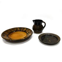 A small collection of 20th Century Coxwold pottery (Yorkshire) including: a large (40.5cm) charge...