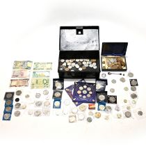 A metal deed box with contents to include silver Morgan dollar, silver coffee bean teaspoon, silv...