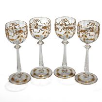 A set of four Moser hock glasses with air twist stems, decorative Puginesque knops and gilt flora...