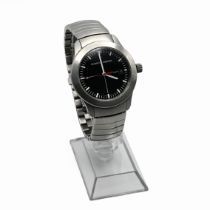 Porsche Design, a gents stainless steel bracelet watch, the black quartered dial with white baton...
