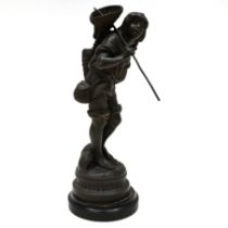 A spelter figure of a boy cockle picker on ebonised wooden socle. Height 49cm (inc socle) 45cm (f...