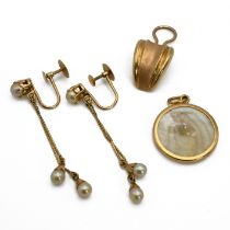 A pair of cultured pearl drop earrings, with screw fittings; a single ear clip stamped ‘750’; and...