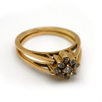 An unusual swivel diamond cluster and sapphire and diamond cluster ring, stamped ’750’, the twin ...