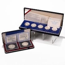 A pair of silver proof coin sets, both issued in commemoration of the Silver Jubilee of Queen Eli...